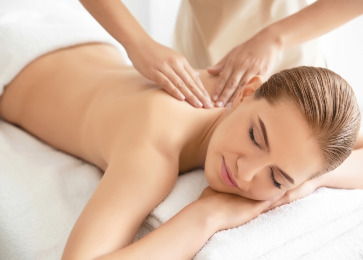 Young beautiful woman having massage in spa salon